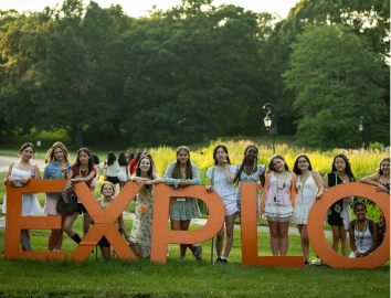 Students outside the EXPLO sign
